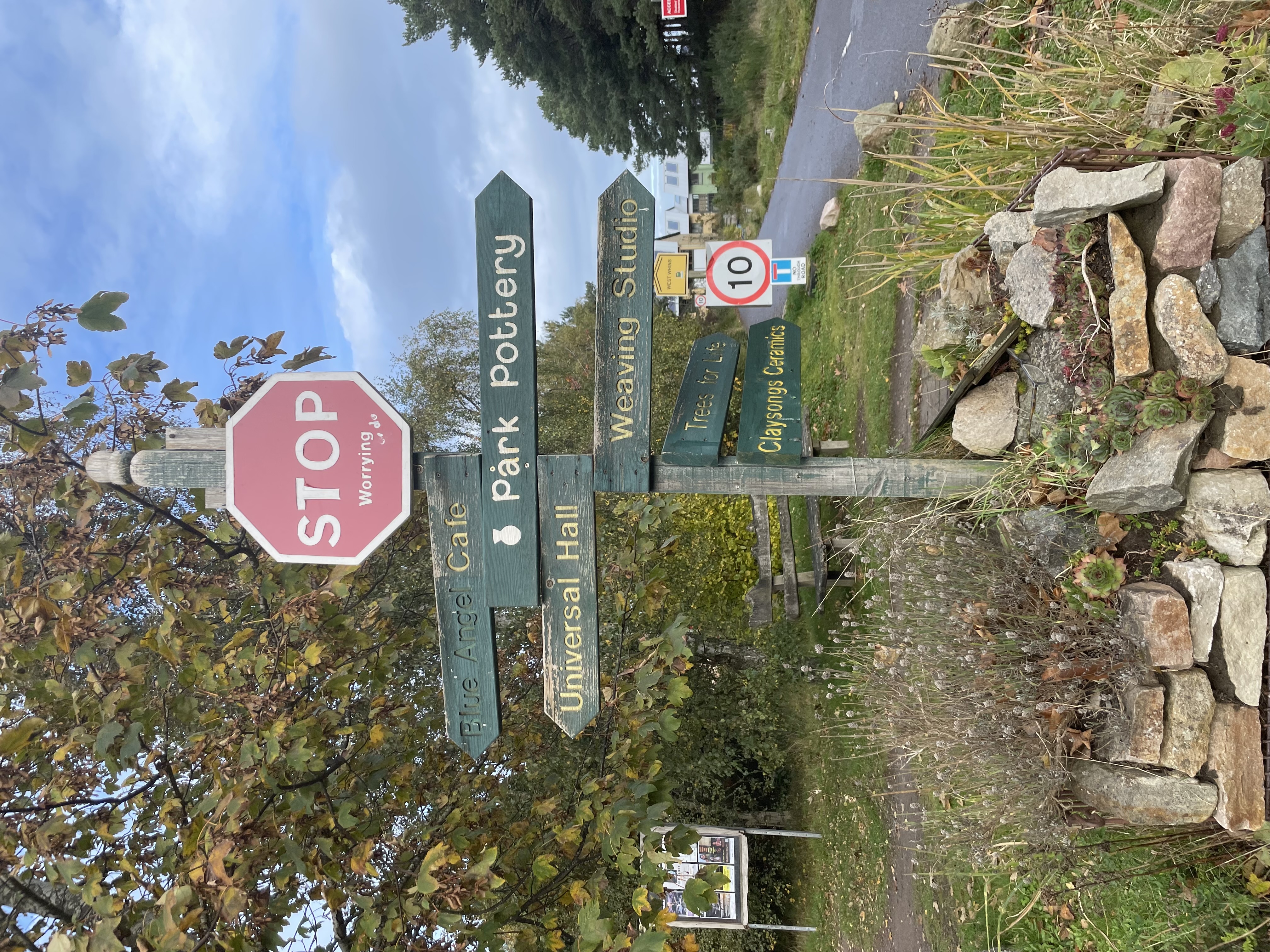 Signpost in Findhorn Ecovillage that says STOP worrying