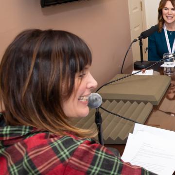 Two women being interviewed for podcast